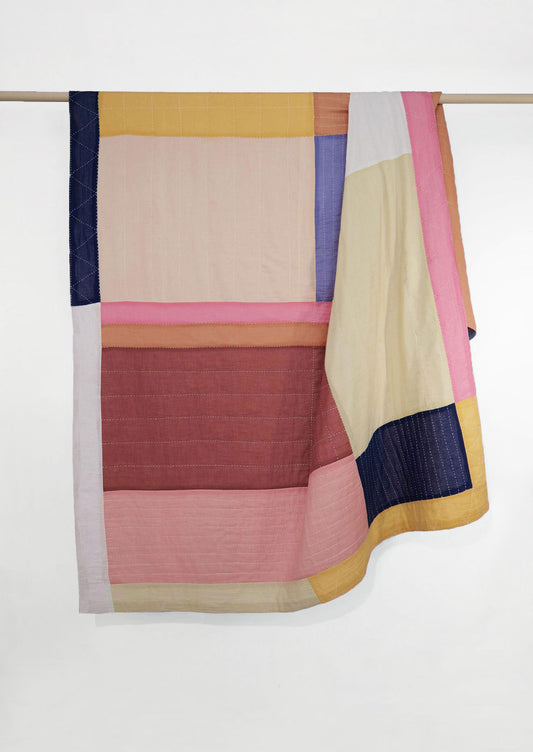Patchwork kantha bedspread made with multicoloured voile offcuts.