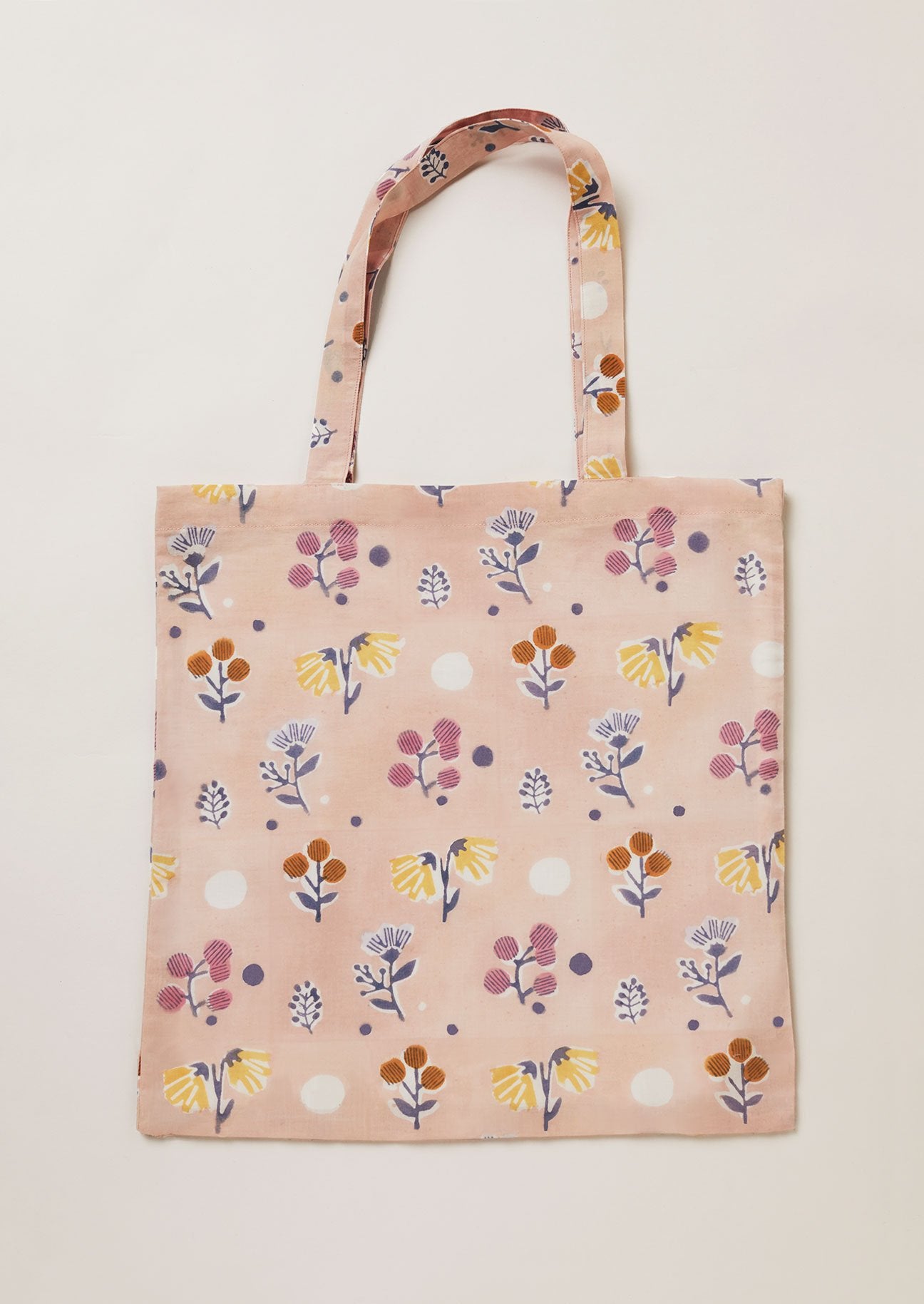 Dusty Pink tote bag with a multicoloured block printed floral design.