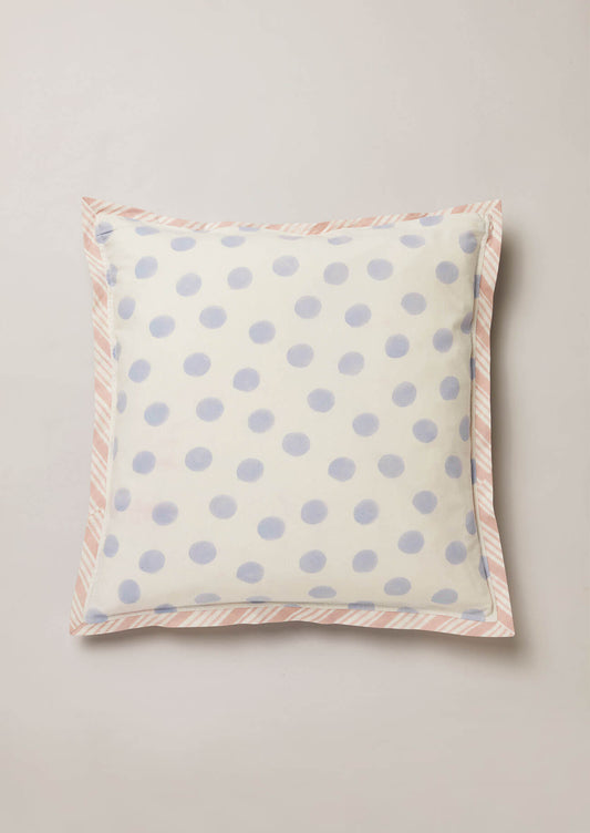 Reverse of block print cushion featuring a blue polka dot design.