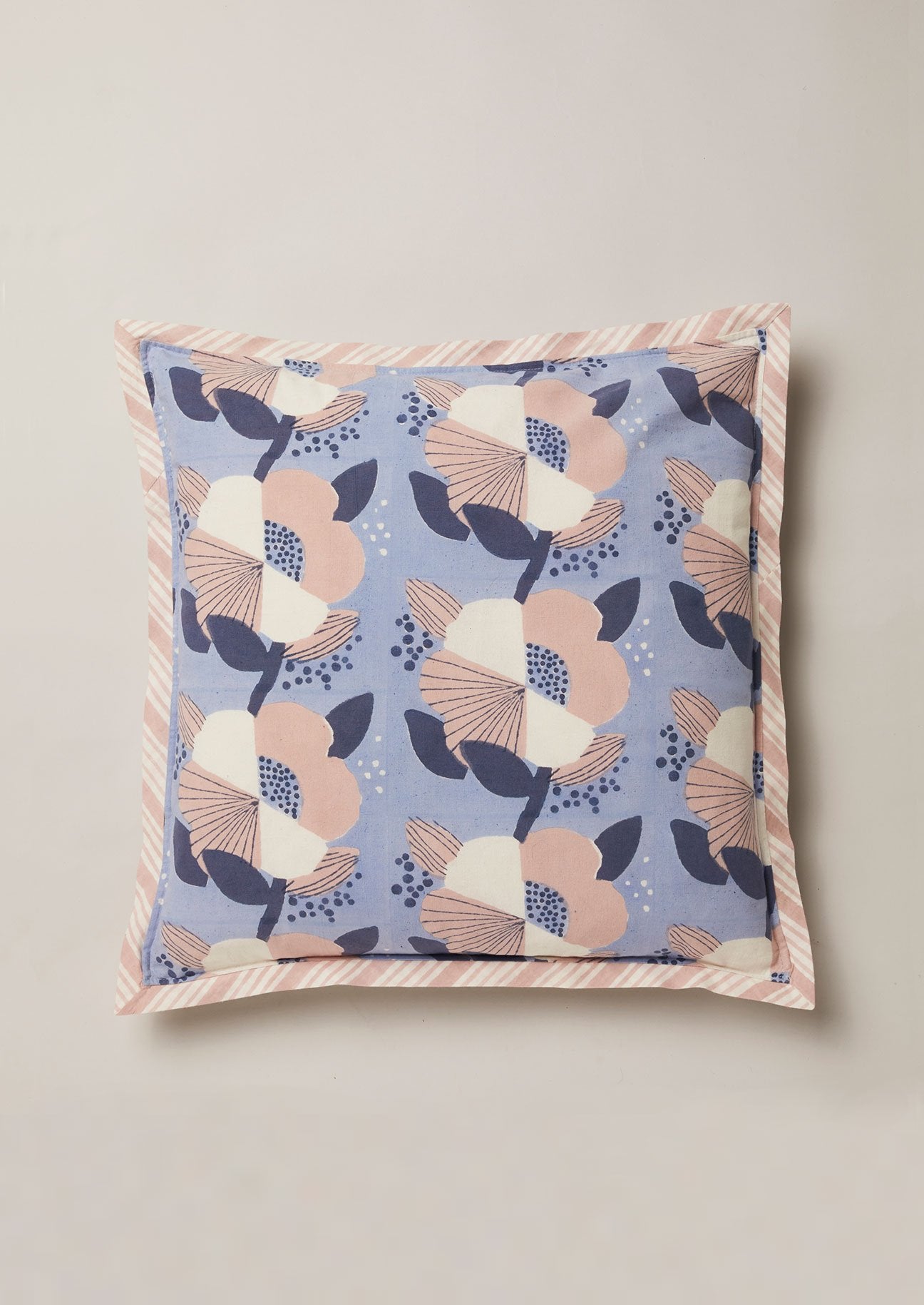 Conrflower blue block print cushion wiht pink and white flowers and pink stripe border
