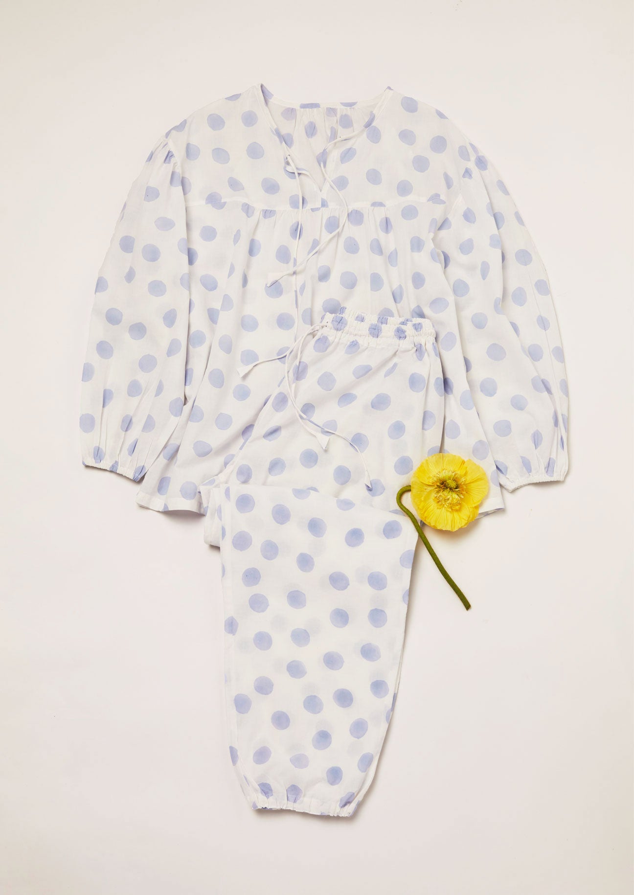 Pyjama set in pale blue dot block printed pnto white cototn voile with yellow poppy decoration.