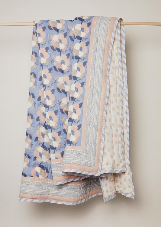 Blue and pink floral block print quilt with reversible polka dot print