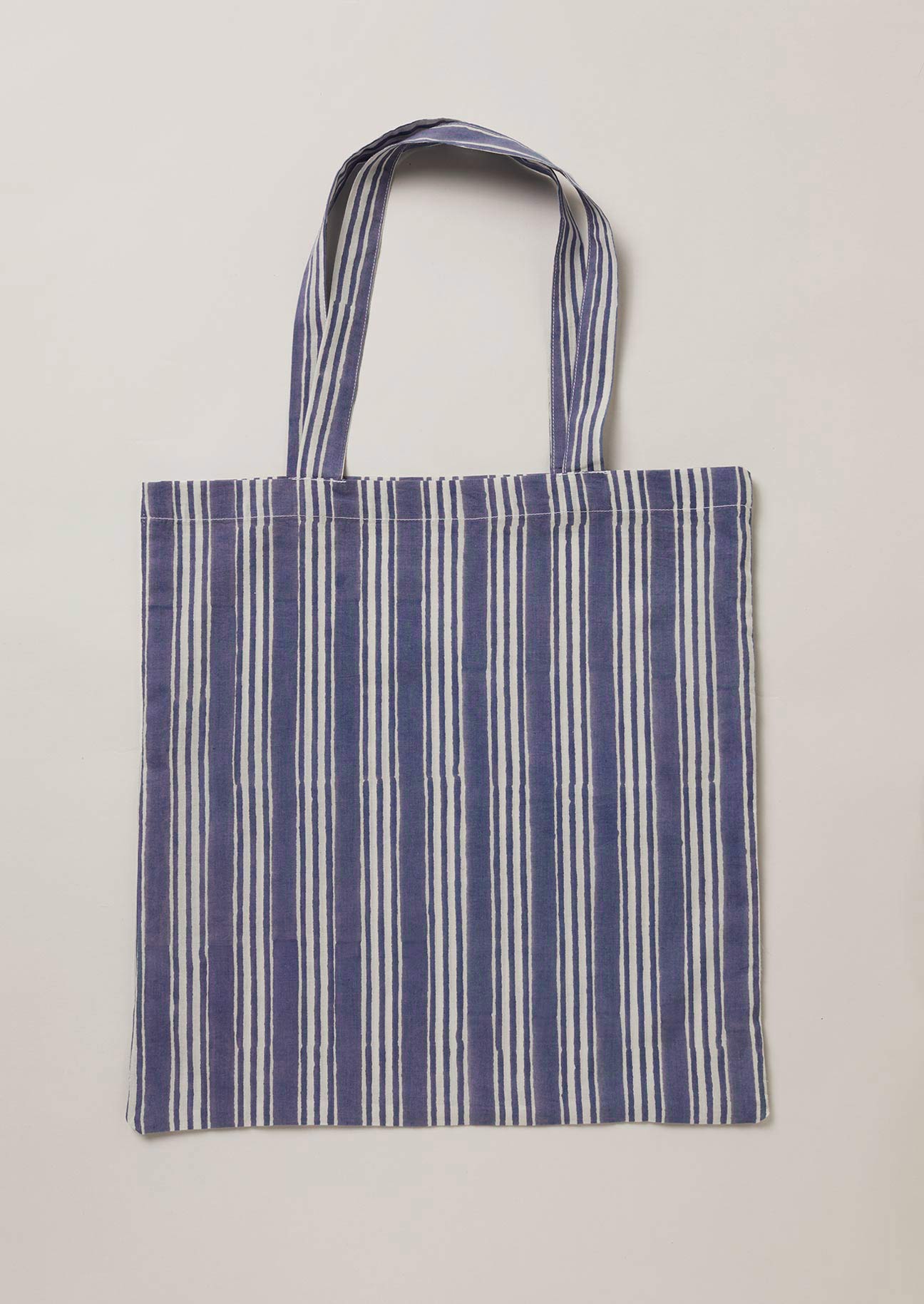 Navy and white block printed stripe tote bag.