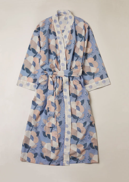 Pale blue kimono in oversized floral block print design with irregular blue spot contrast border.
