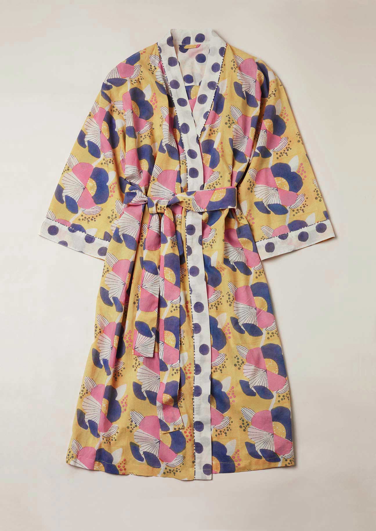 Yellow dressing gown with large scale block printed flowers and an oversized spot border.